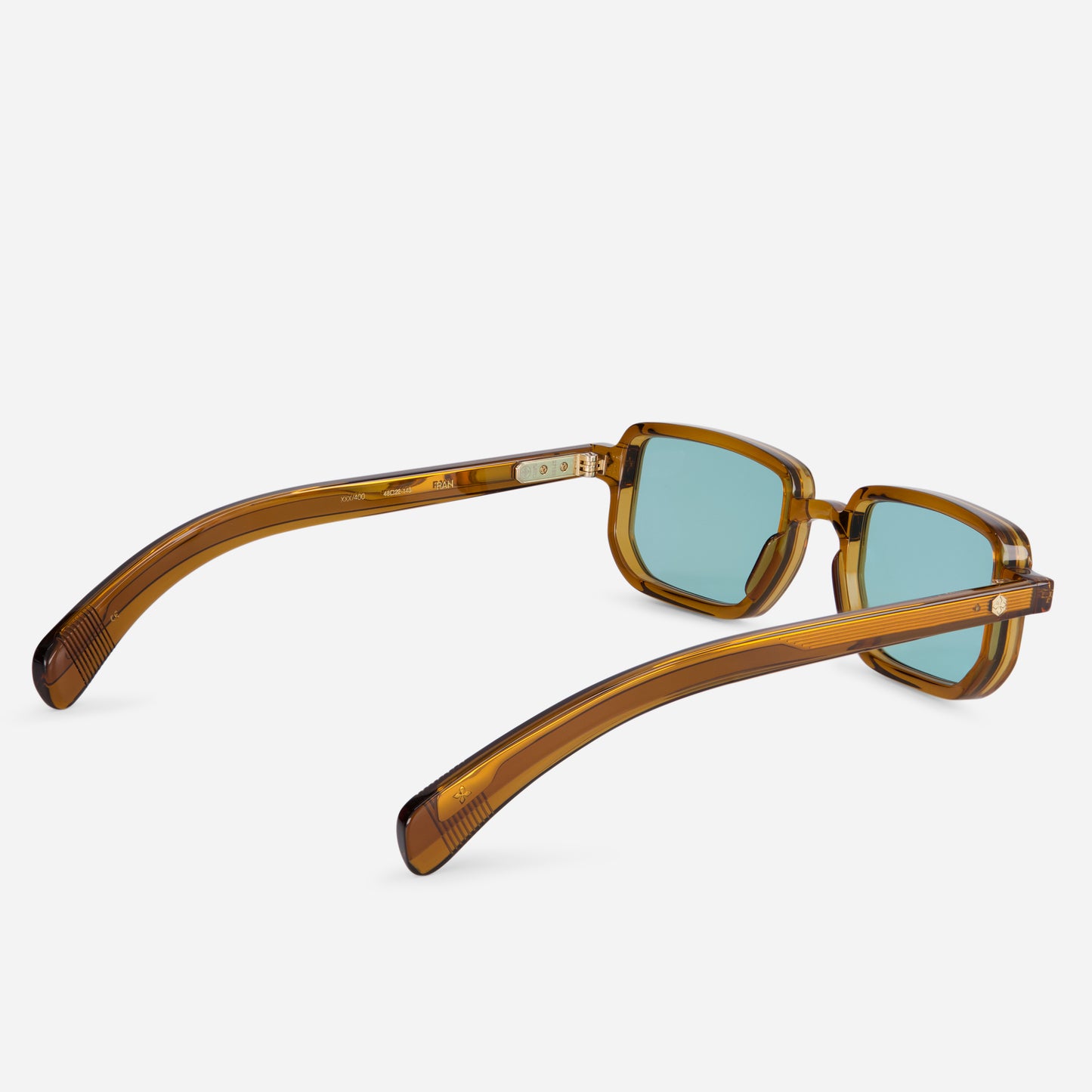 Elevate your eyewear collection with Ran MC-1, presenting a Japanese acetate frame in Maple Crystal color (clear brown) and Blue flash lenses.