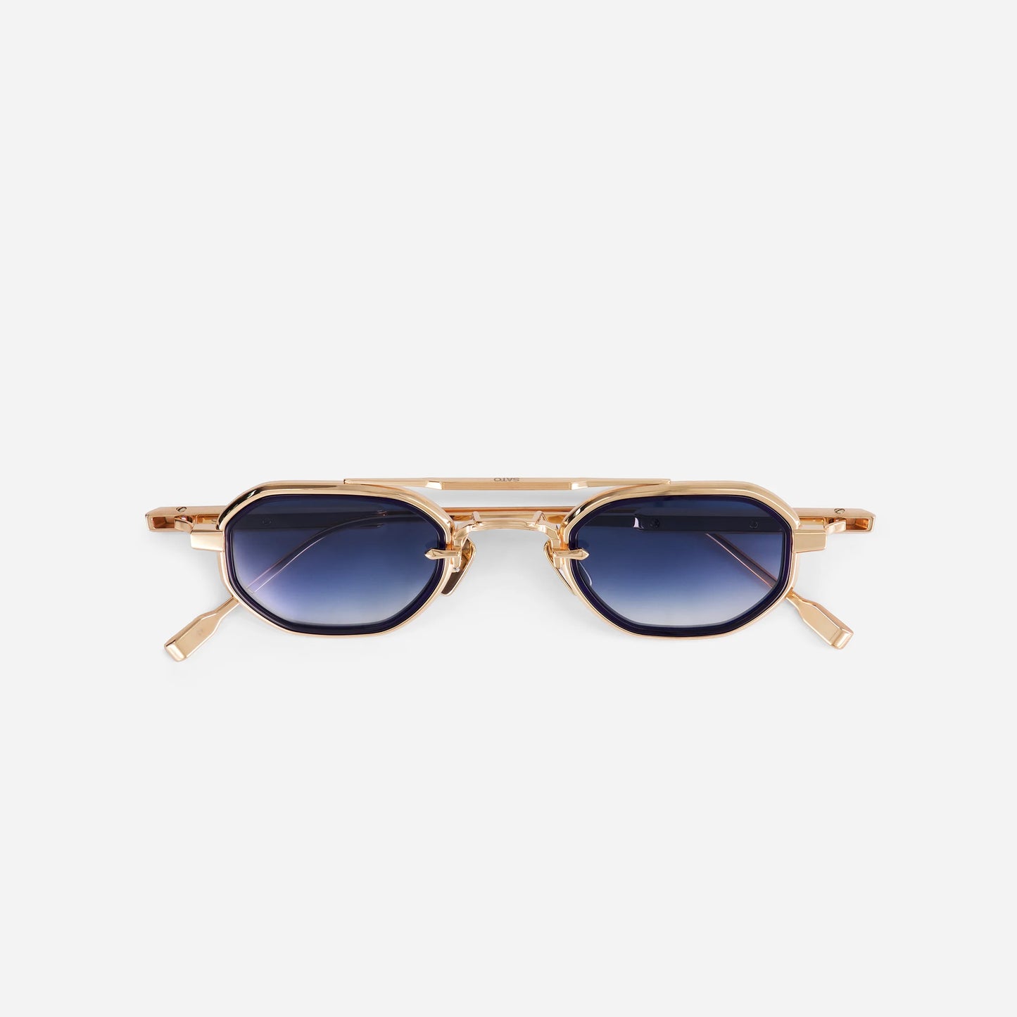 Avior RG-1 sunglasses in rose gold with a midnight blue insert and blue gradient lenses, made by SATO in Japan. Limited edition.
