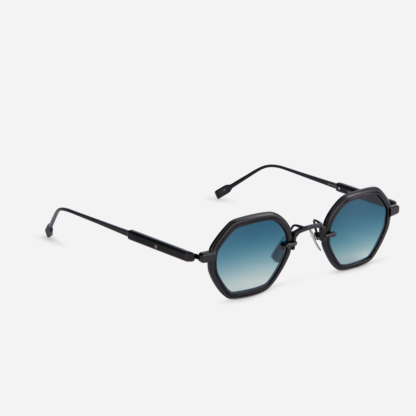 Arraï-T B-1 by Sato is designed with a titanium frame, black mat coating, black takiron rim insert, and gradient deep sea blue lens.