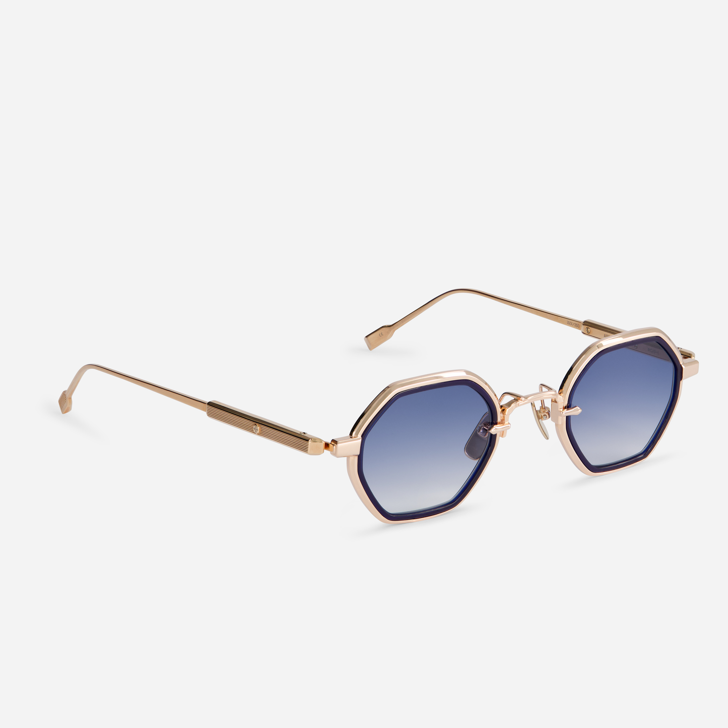 Arraï-T RG-1 is designed with a titanium frame, rose gold coating, dark blue takiron rim insert, and gradient dark blue lenses. SATO