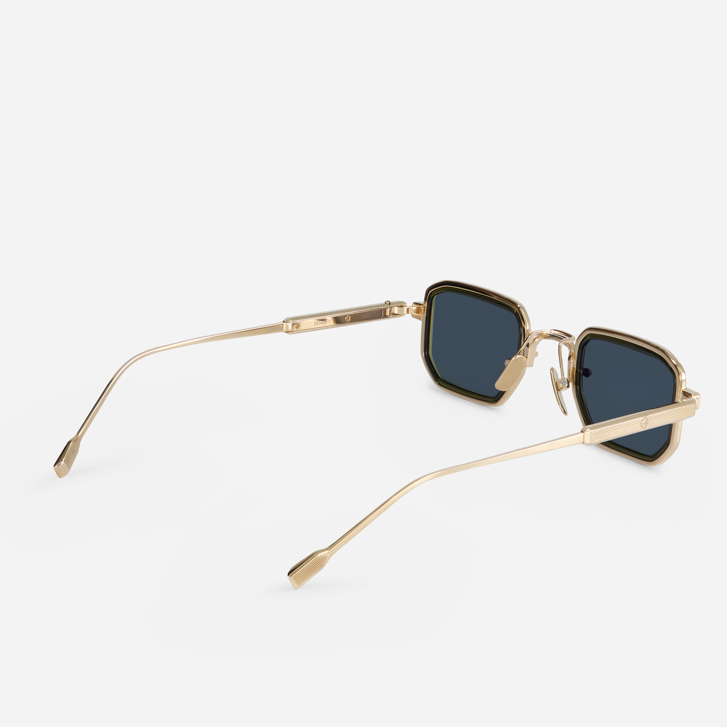 Deneb-T LG-1 showcases titanium-framed glasses with a lunar gold coating. These glasses also include a green olive takiron rim insert and G15 green lenses.