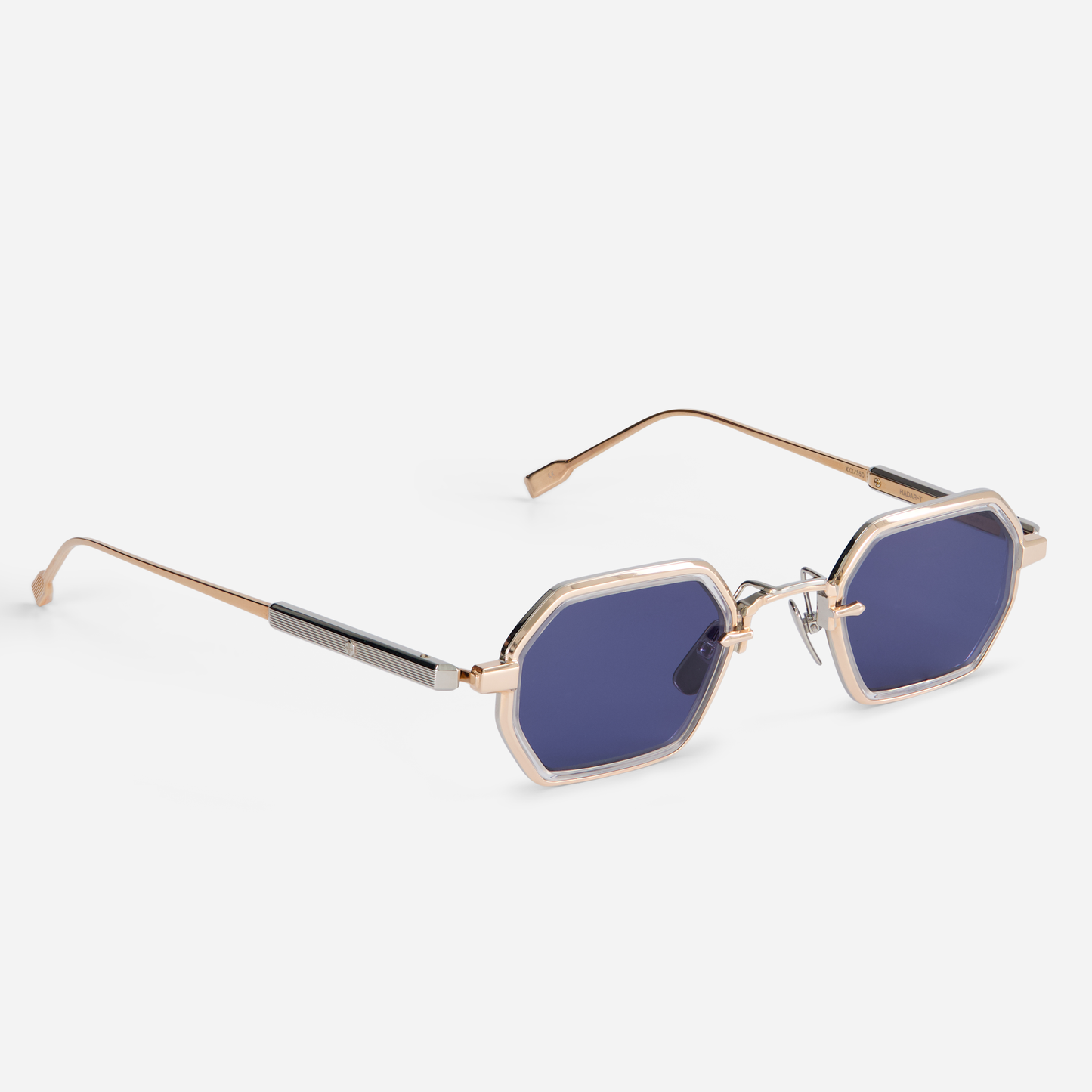 The Hadar-T RG/P-1 eyeglasses, meticulously crafted, feature a titanium frame with a captivating rose gold coating. They are thoughtfully designed with crystal takiron rim inserts and BL-16 lenses.