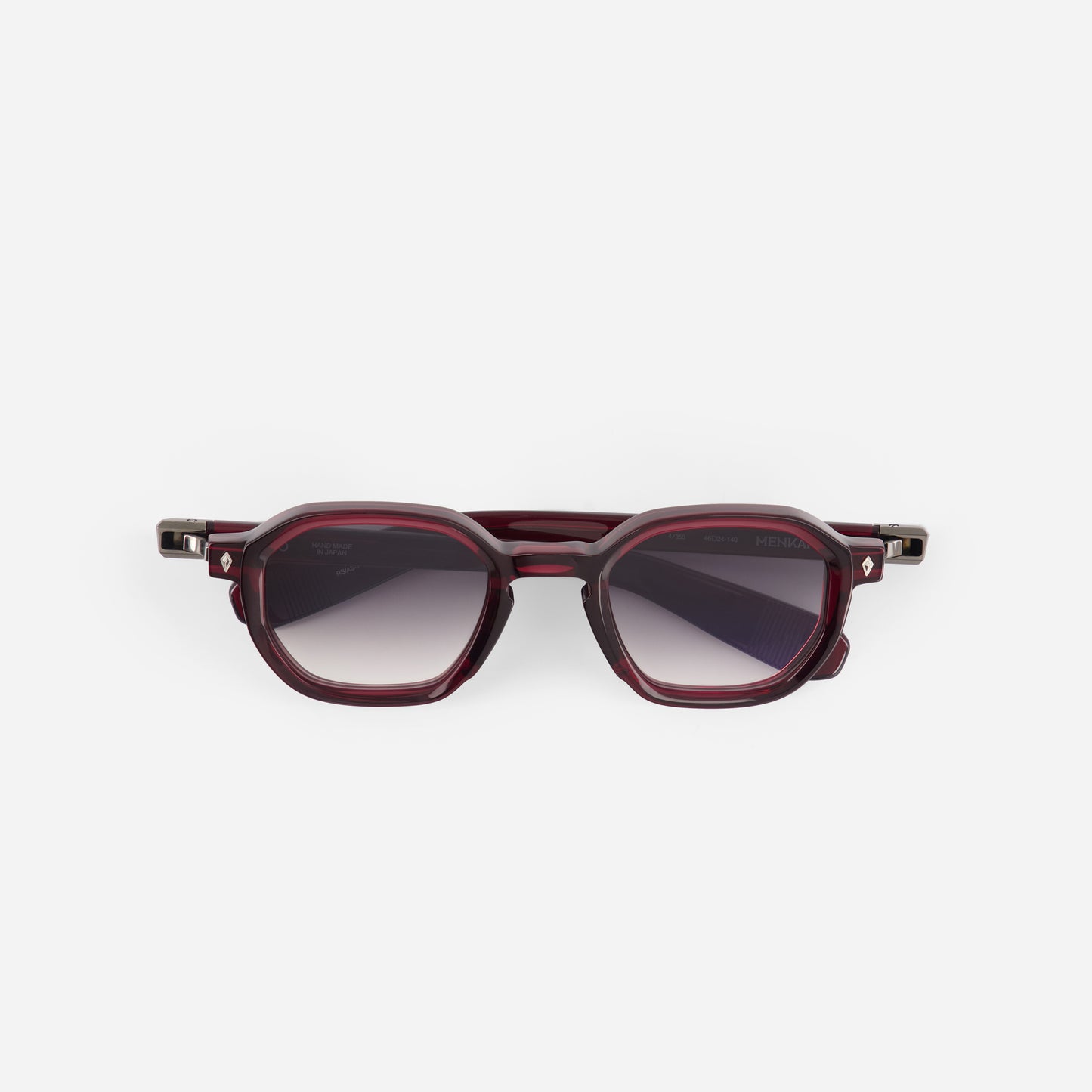 Sunglasses with a red frame on a white background