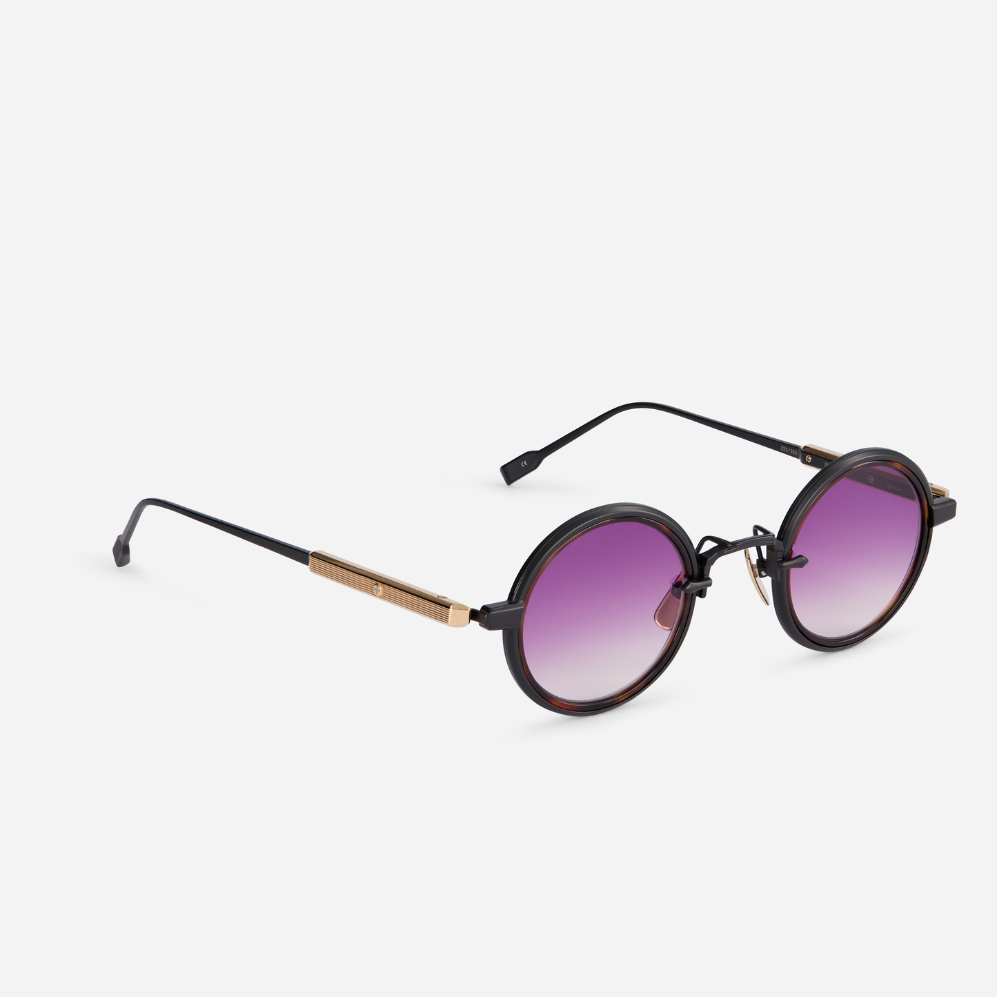 Rotanev-T B/RG comes with a titanium frame, black mat and rose gold coating, tortoise takiron rim insert, and gradient purple lenses