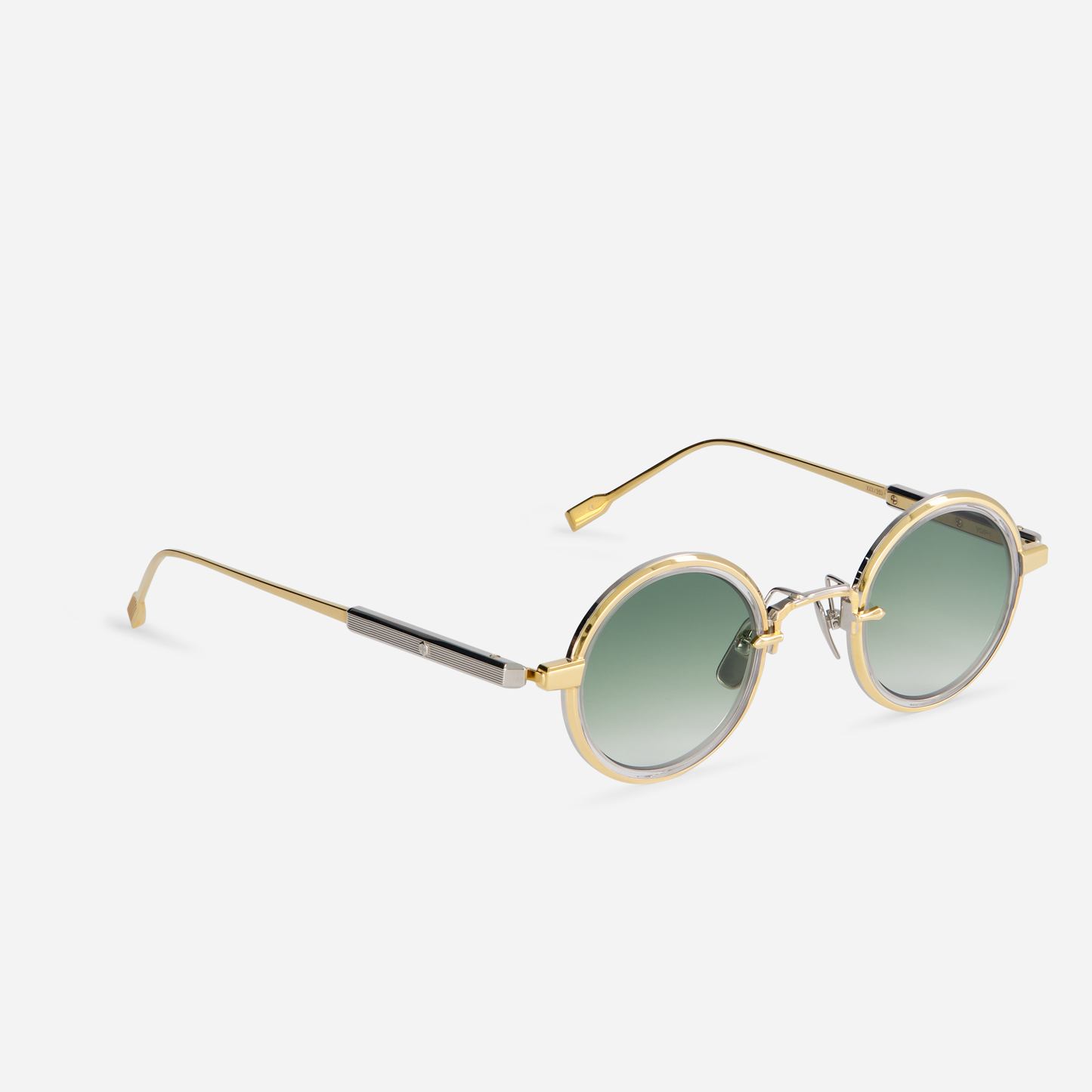 Rotanev-T YG/P-1 comes with a titanium frame, yellow gold, and platinum coating, crystal takiron rim insert, and gradient green lenses.
