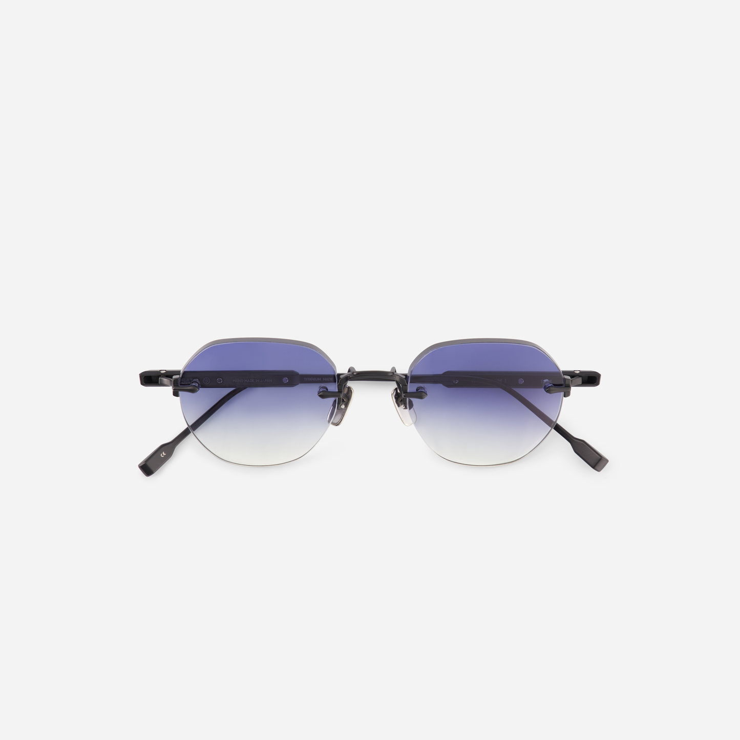 Terebellum 1 S607, a round rimless frame in Titanium with a matte black coating, paired with stunning gradient dark blue lenses