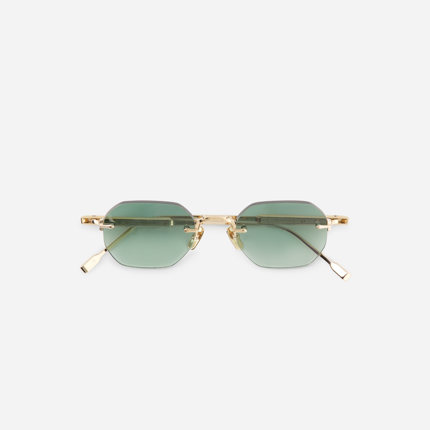 Terebellum II S702, showcasing Lunar Gold details and a square rimless silhouette complemented by gradient green lenses.