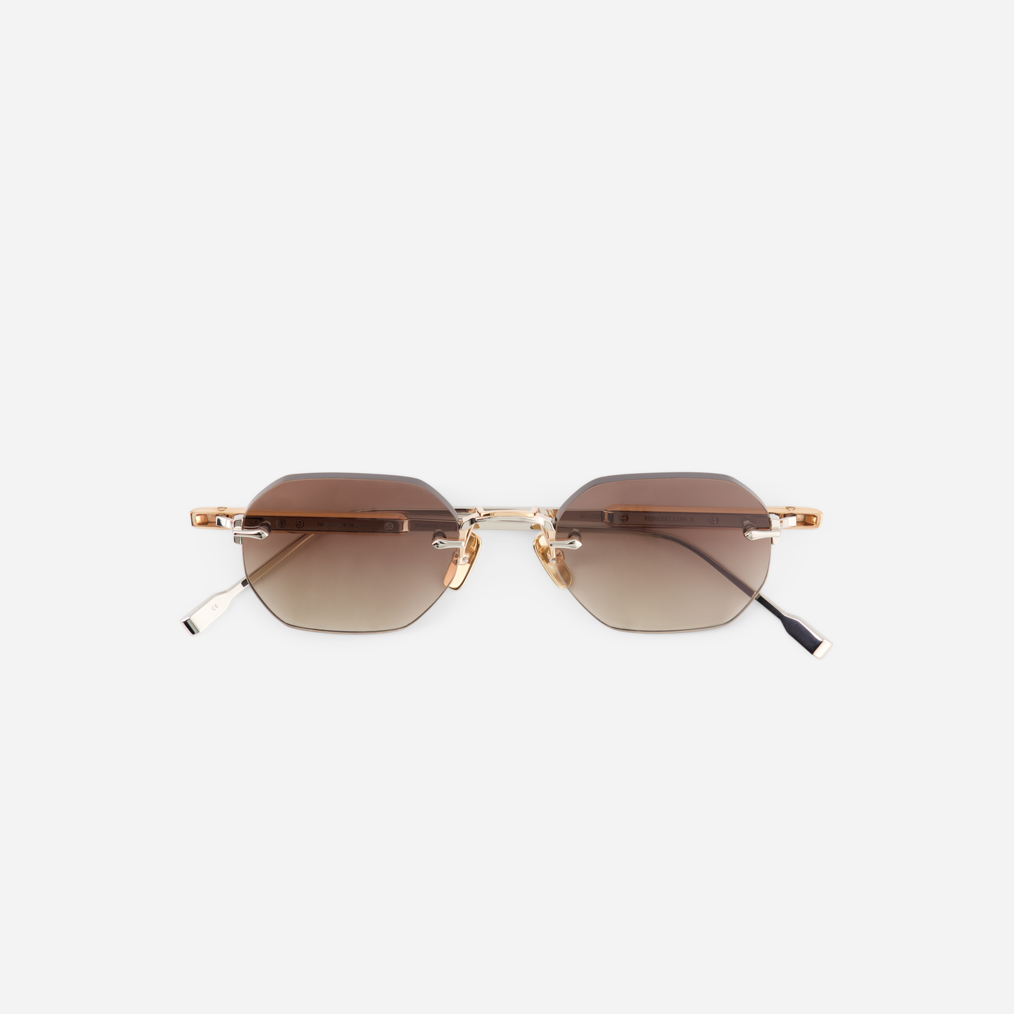 Terebellum II S704, featuring gradient brown lenses, rose gold, and platinum accents for an exquisite touch of luxury.