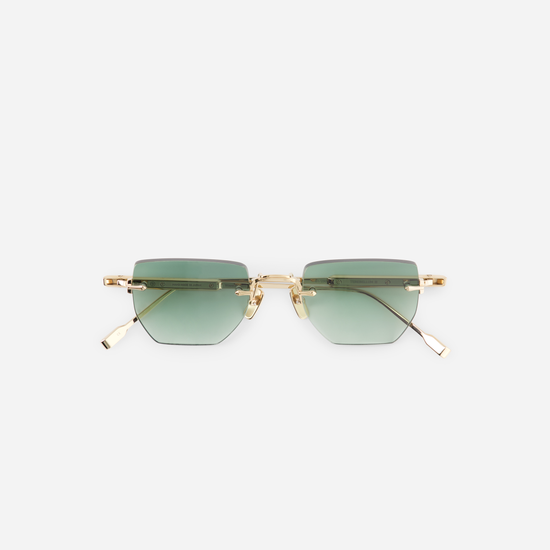 Terebellum III S802: Green lenses meet lunar gold elegance.