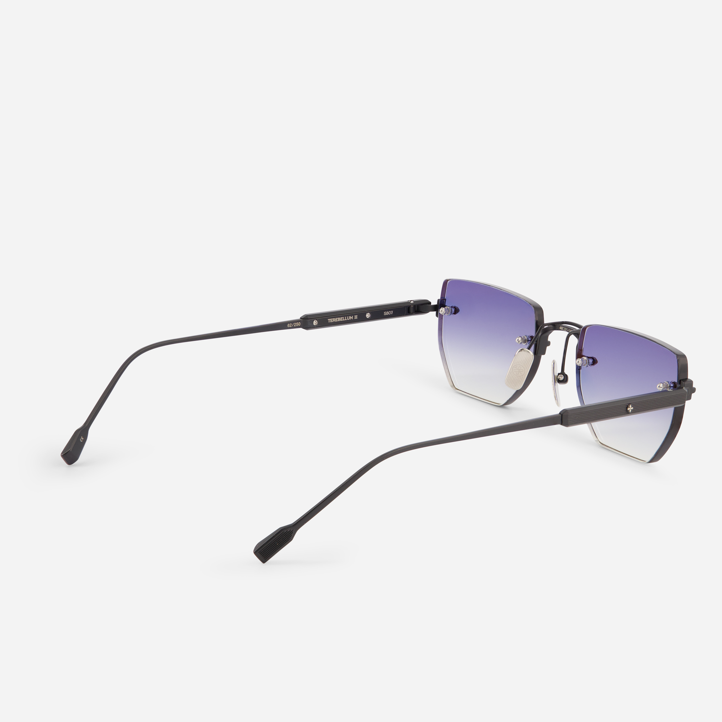Sato's Rimless Collection with the Terebellum III S804, boasting a Titanium frame, matte black coating, gradient dark blue lenses.