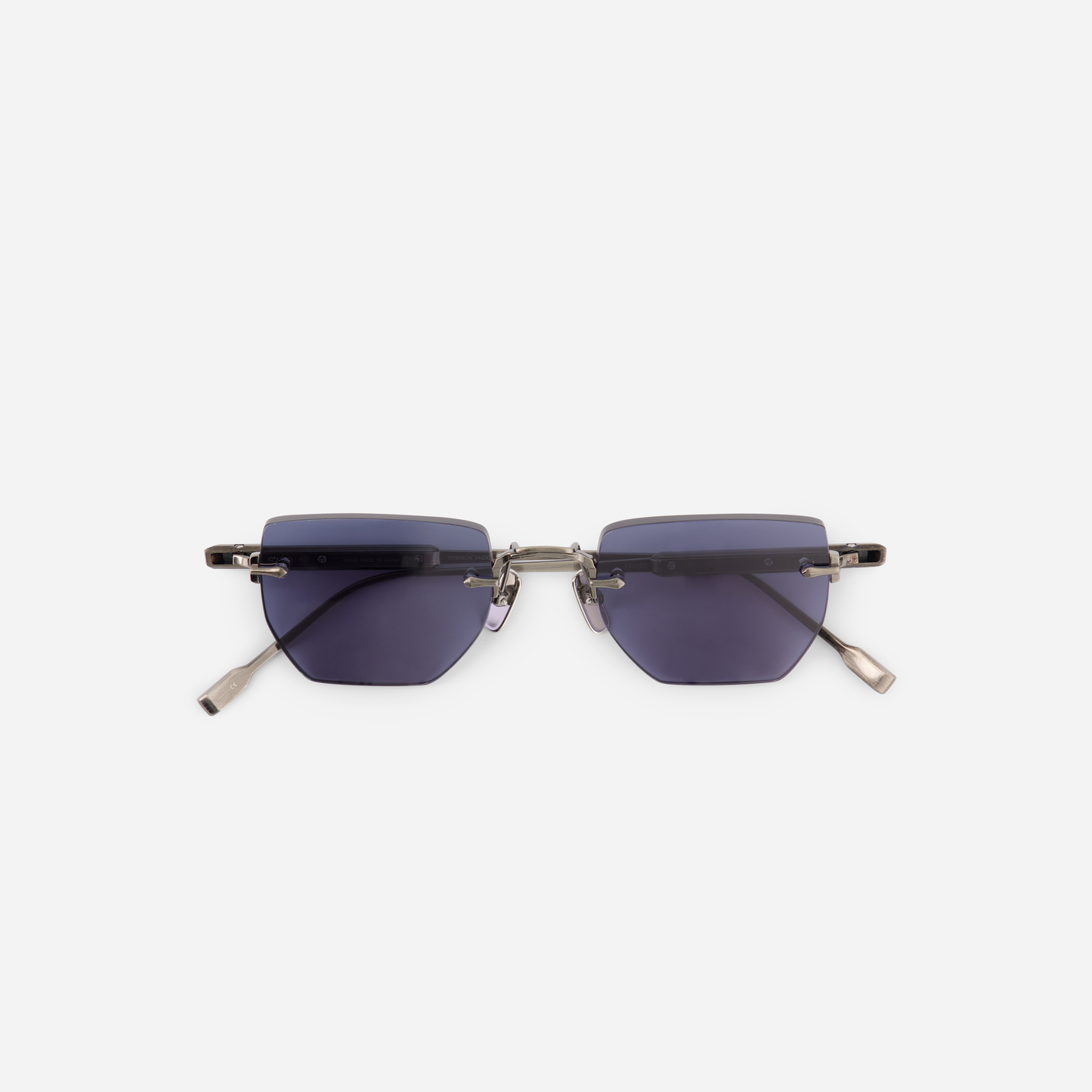 Terebellum III S808 from Sato's Rimless Collection, boasting a Titanium frame, antique silver coating, and mesmerizing BL16 blue lenses.