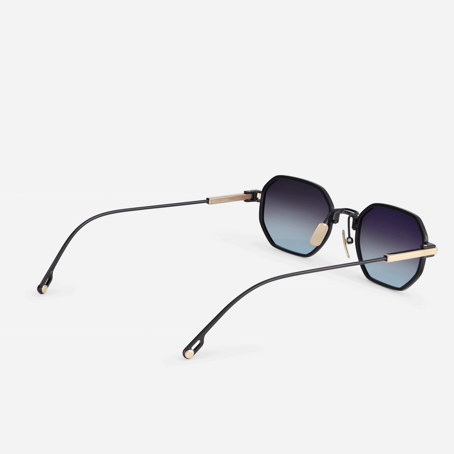 Timir S506 hexagonal glasses. Meticulously crafted from black and palladium titanium, with exquisite grey gradient tinted lenses.