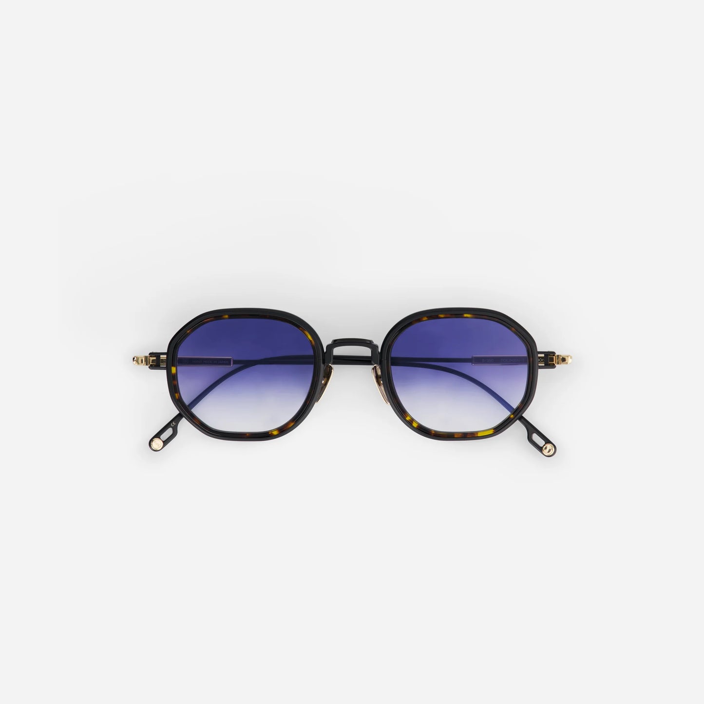 Toliman-T S3306 hexagonal sunglasses. Made from high-quality black titanium, these distinctive eyewear pieces feature dark blue gradient lenses for a sleek look, accentuated by a tortoise insert.