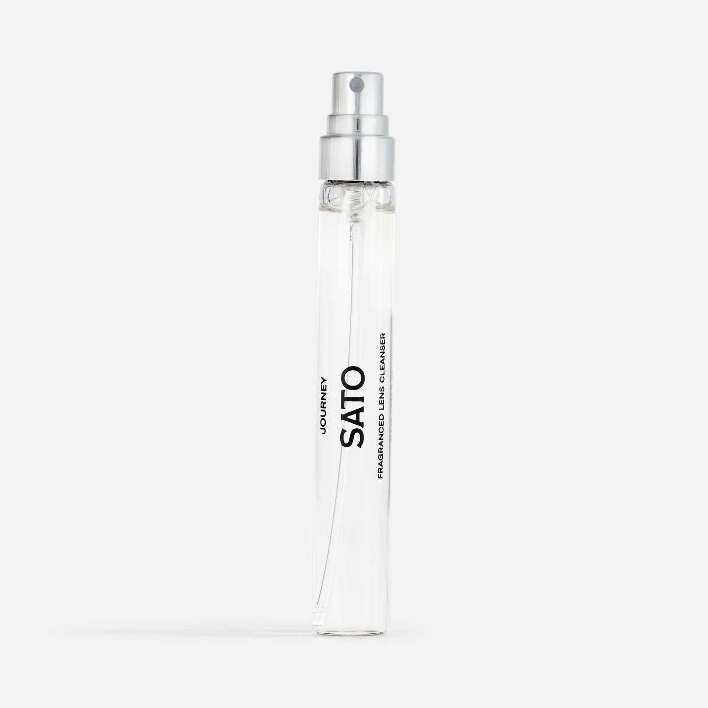 Clear spray bottle with silver nozzle on a white background