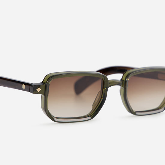 Ran H-1 showcases a Japanese acetate frame in the unique Hunter color with tortoise arms and green front, perfectly paired with gradient brown lenses.