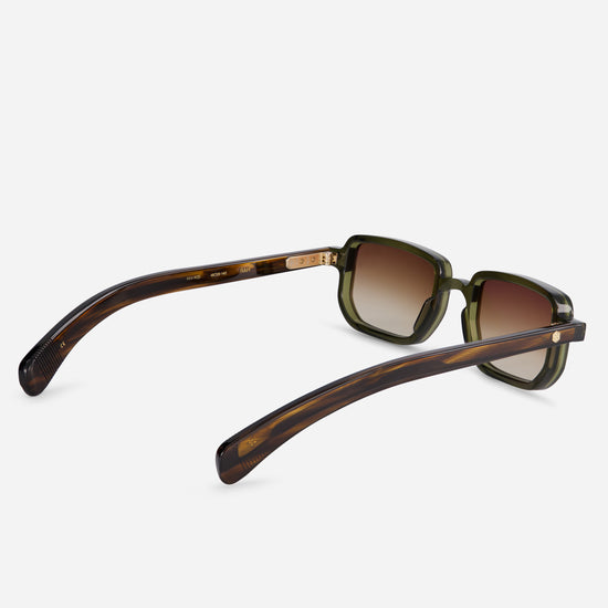 Ran H-1 offers a stylish Japanese acetate frame in Hunter color with tortoise arms, a green front, and gradient brown lenses, presenting a contemporary look.