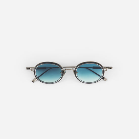Sato sunglasses in brushed bronze color and gradient blue lenses
