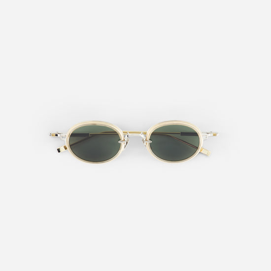 Silver sunglasses with green lenses on a white background