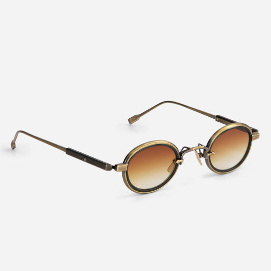 Algedi-T AG/AS-1 features small, round frames in antique gold and antique silver with an olive insert