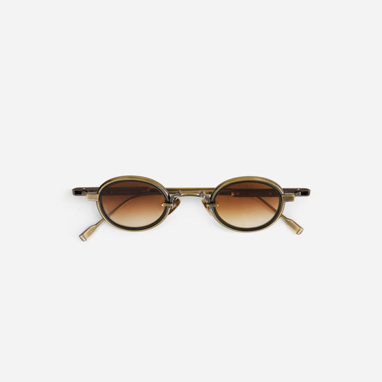 Algedi-T AG/AS-1 sunglasses in antique gold and antique silver with an olive insert, designed with small, round frames