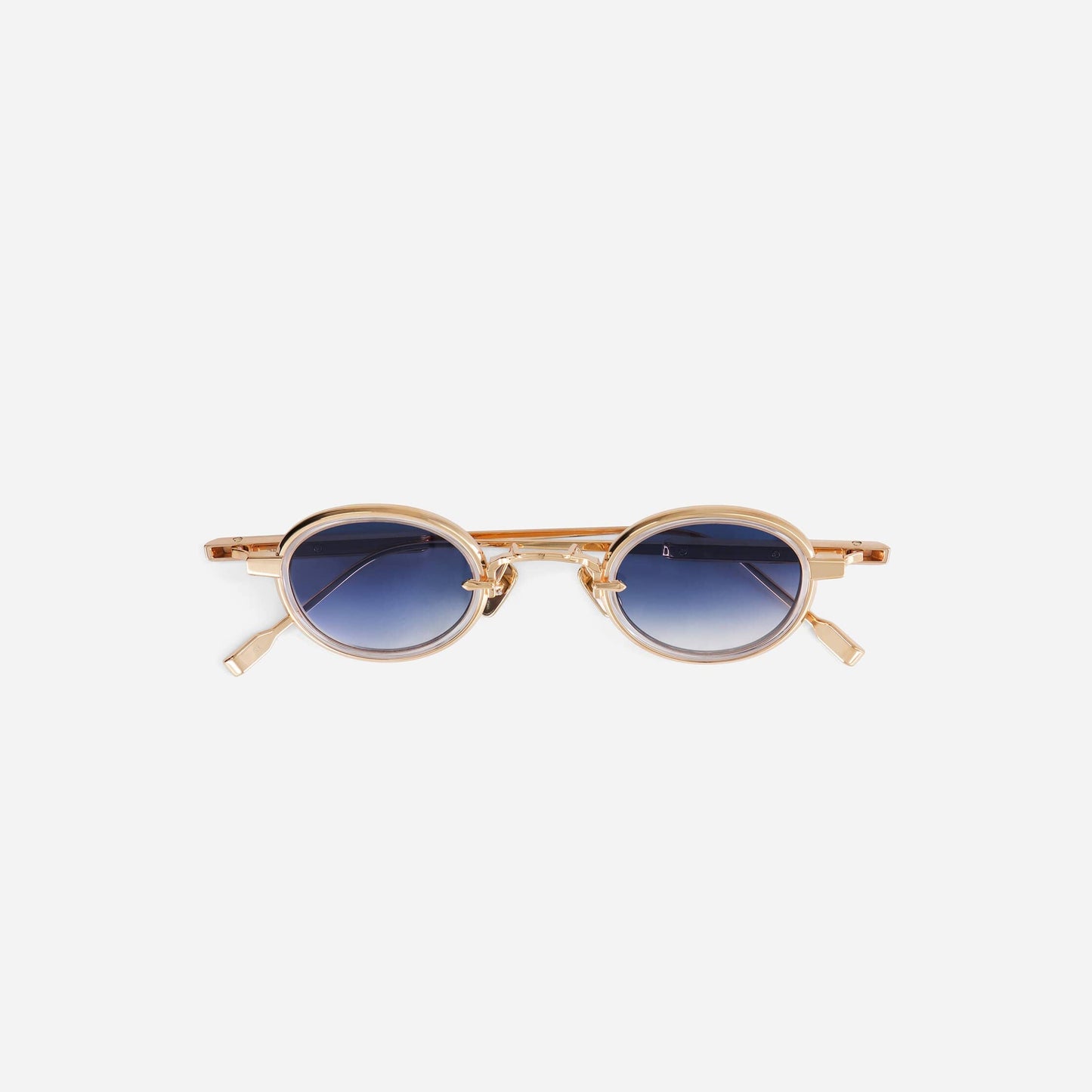 Algedi-T RG-1 sunglasses in rose gold with a crystal insert and blue gradient lenses, crafted and individually numbered in Fukui