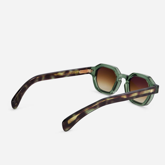 Almach TA-1 features dark green acetate frames with tortoise green temples.