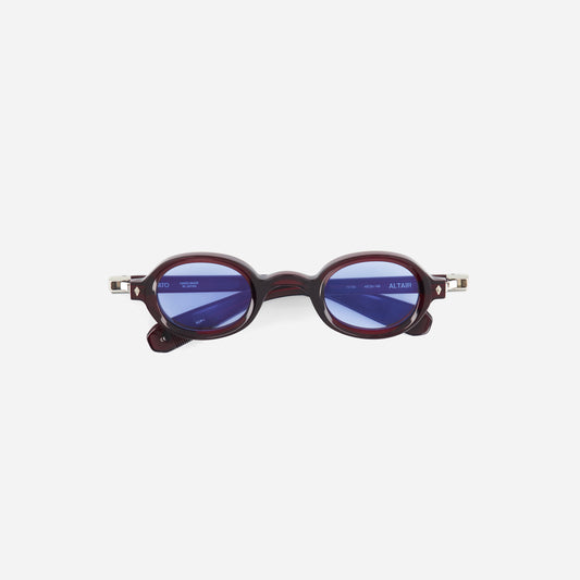 Round sunglasses with a dark red oval frame on a white background