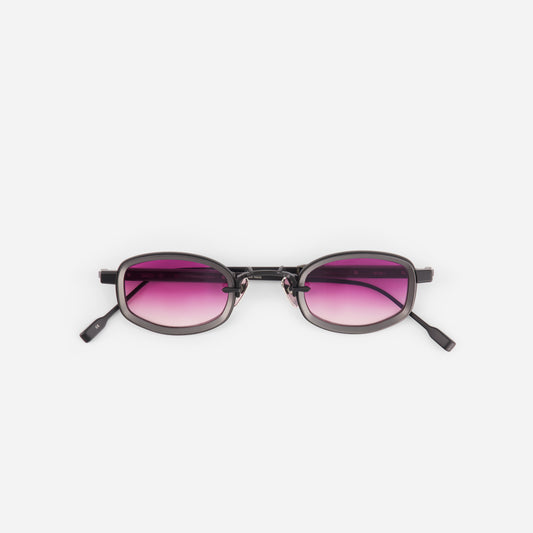 Sunglasses with pink gradient lenses on a white background