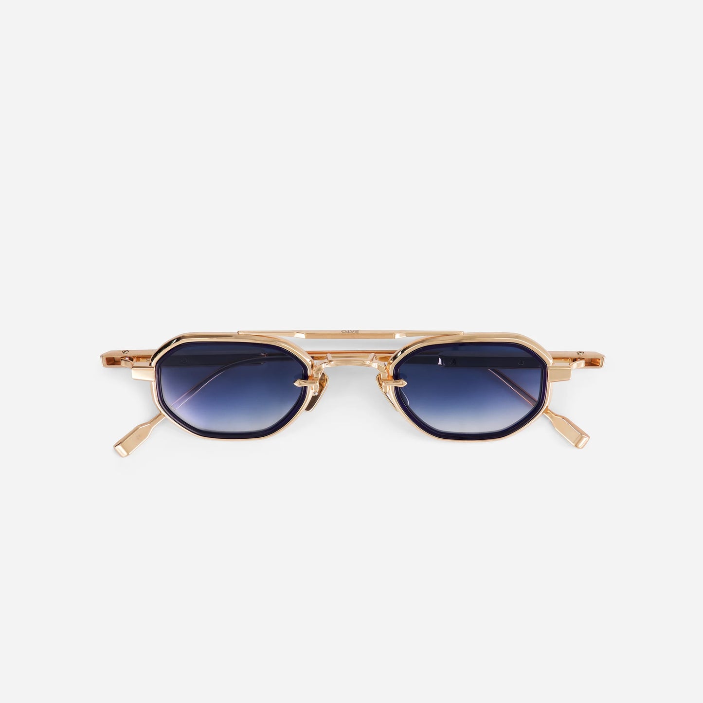 Avior RG-1 sunglasses in rose gold with a midnight blue insert and blue gradient lenses, made by SATO in Japan. Limited edition.

