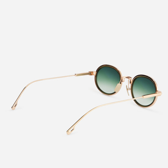 Sato men and women's sunglasses with a gold titanium frame and gradient tinted lenses.