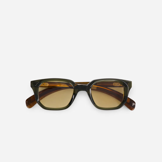 Elevate your eyewear game with the Aliot B-1, featuring a Japanese acetate frame in the captivating Bombardier color, harmonized with stylish yellow-brown lenses.