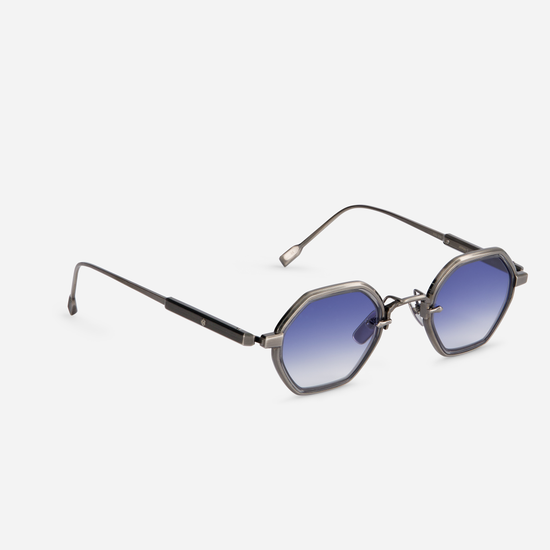 The Arraï-T AS-1 features a titanium frame with an antique silver coating, along with a crystal grey takiron rim insert and gradient blue lenses.