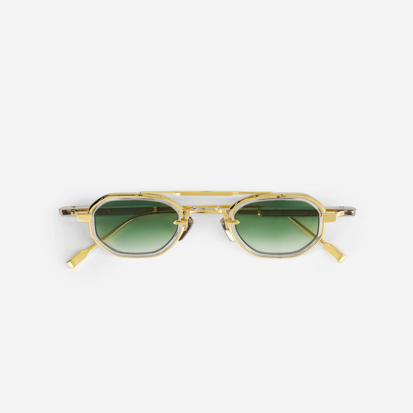 Avior YG/P-1 sunglasses in yellow gold with green gradient lenses. A sleek design for everyday wear.
