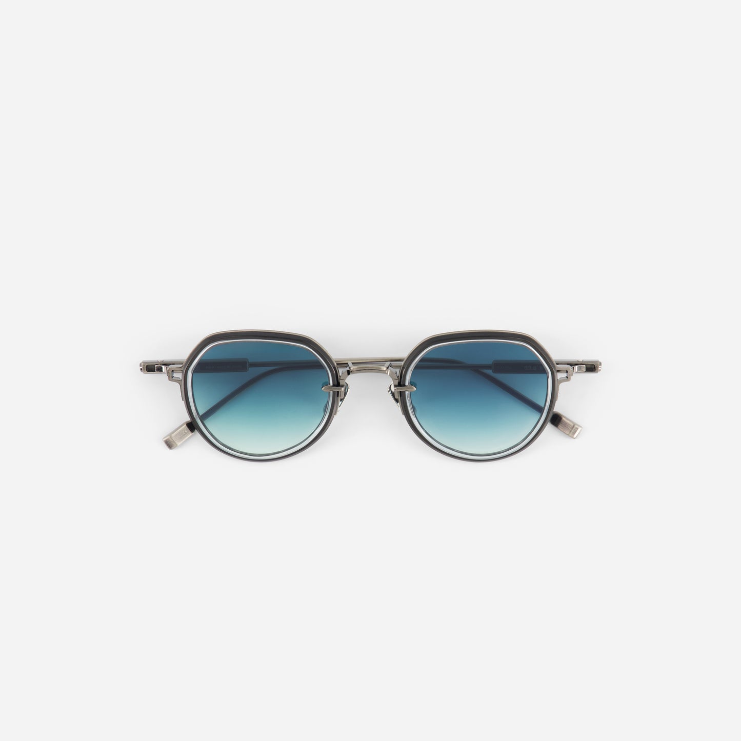 Round sunglasses with blue gradient lenses on a white background