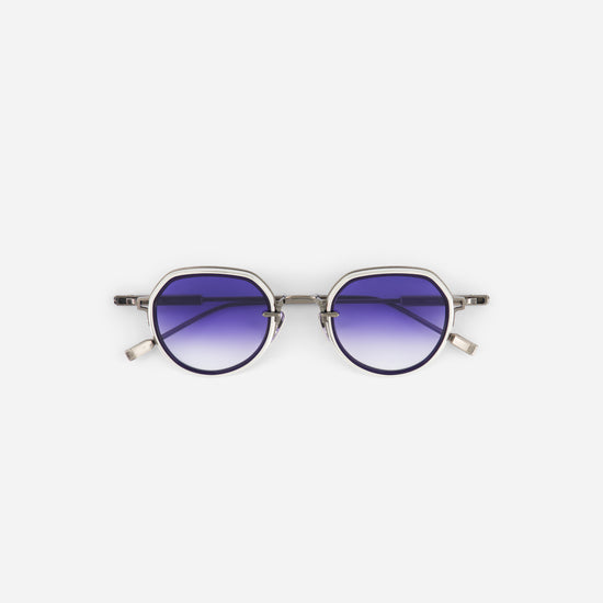 Round sunglasses with purple gradient lenses on a white background