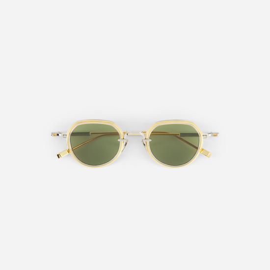 Yellow gold sunglasses with green lenses on a white background