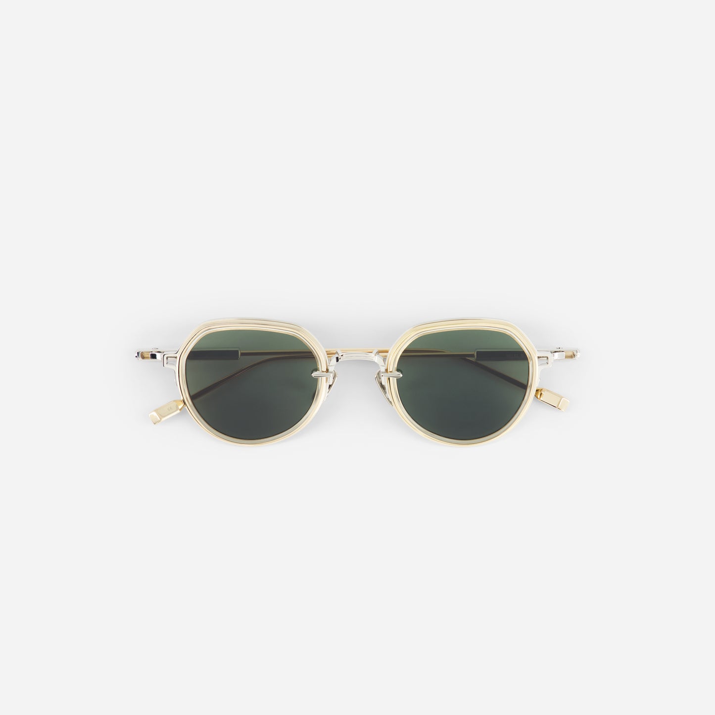 Sunglasses with gold frame and dark lenses on a white background