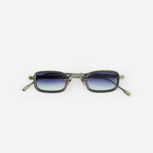 Sunglasses with gradient blue lenses on a white background