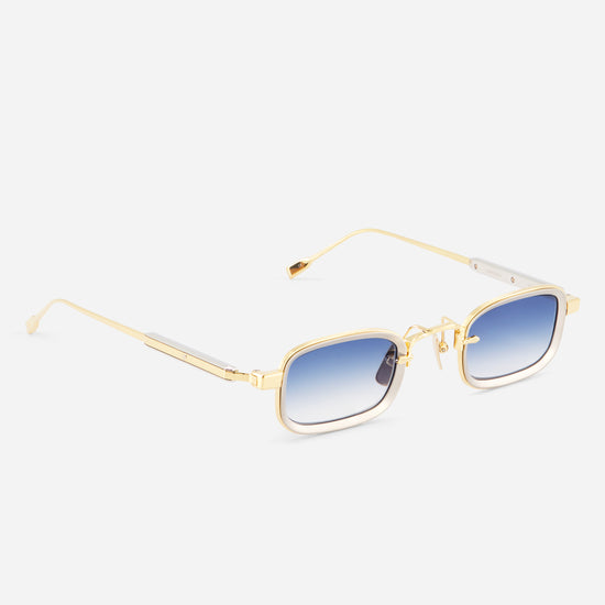 Gold-framed sunglasses with blue gradient lenses on a white background