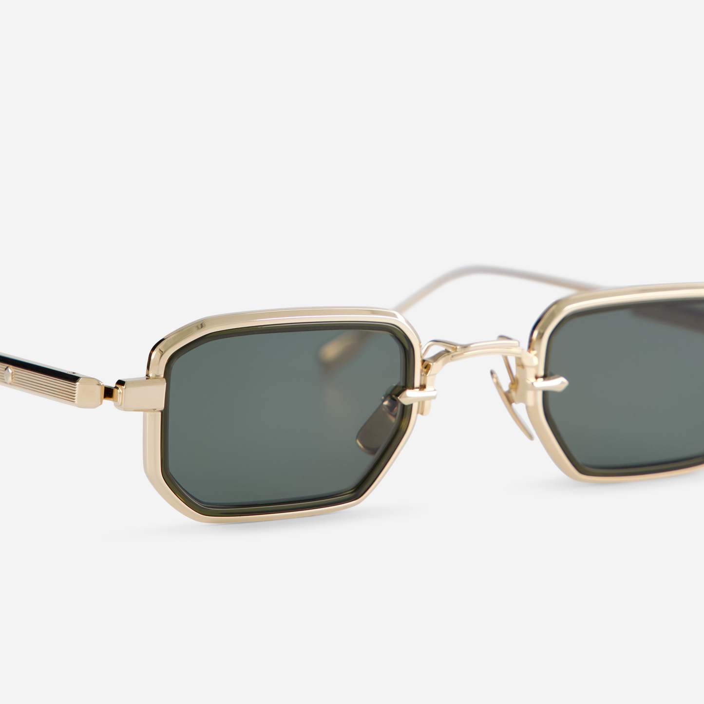 With a titanium frame adorned with a lunar gold coating, the Deneb-T LG-1 eyewear incorporates a green olive takiron rim insert and G15 green lenses.