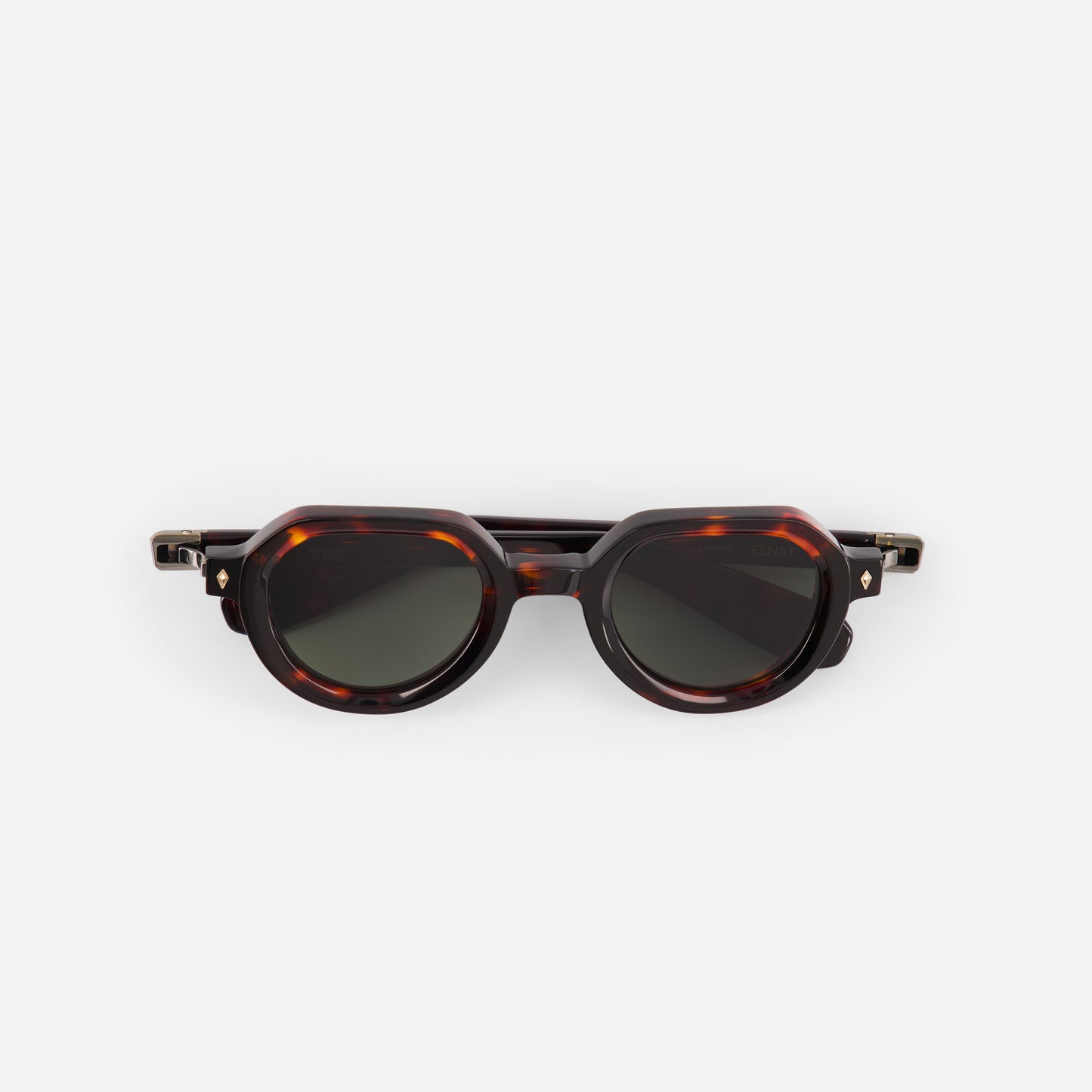 Sunglasses with tortoiseshell frame and dark lenses on a white background