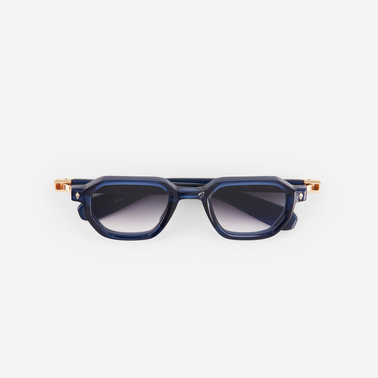 Blue sunglasses with gold accents on a white background