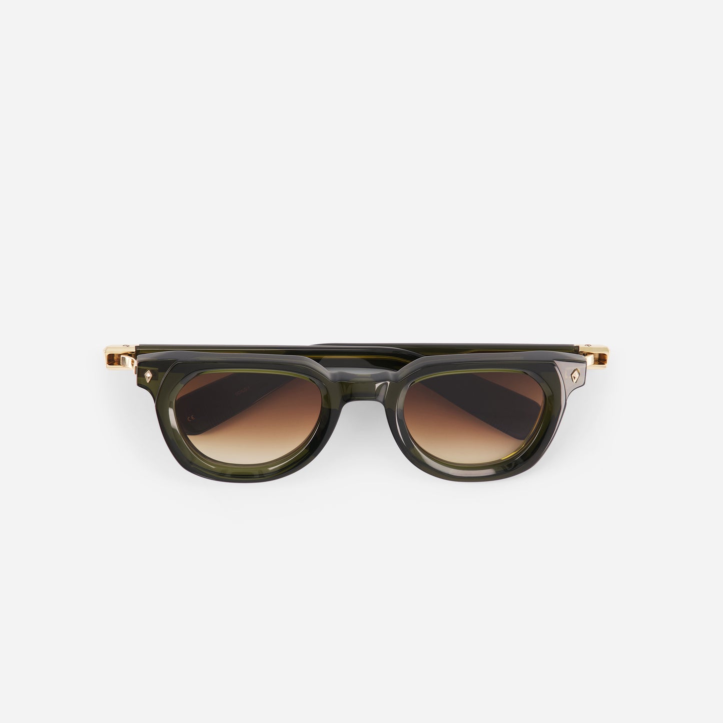 Green sunglasses with a gold frame and dark gradient brown lenses on a white background
