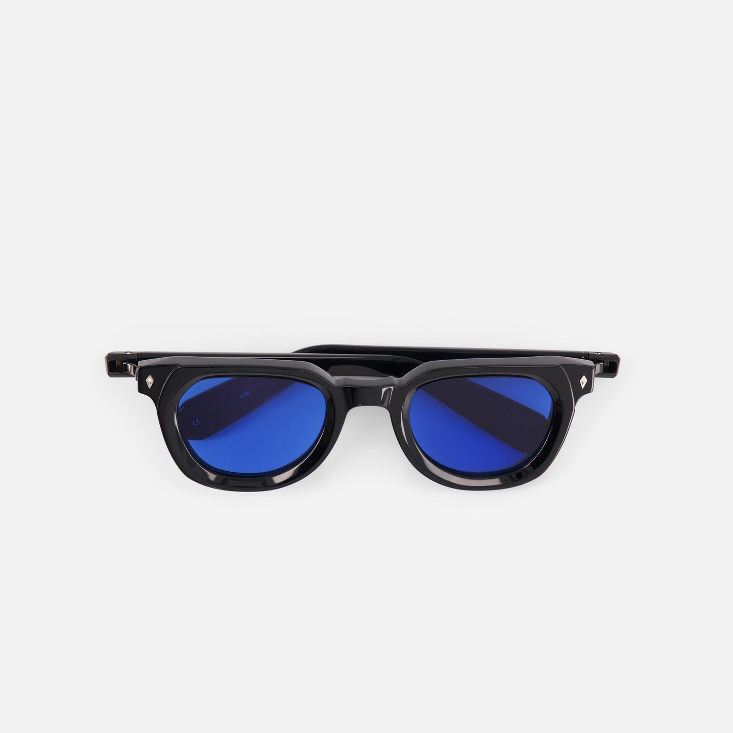 Black sunglasses with blue lenses on a white background