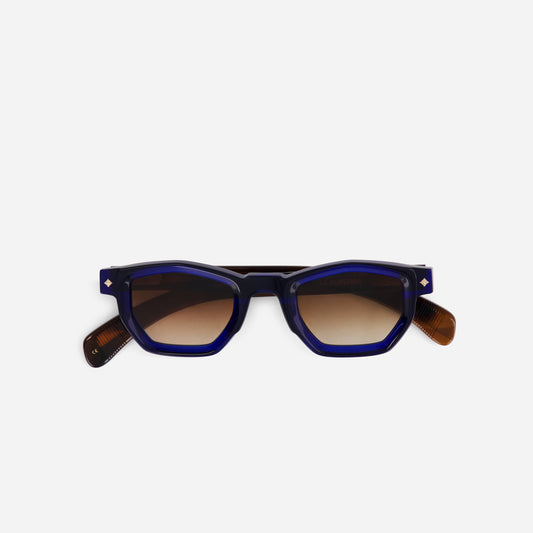 La Superba Z-1 sunglasses feature a bold Zenith design with blue and light tortoise frames, paired with warm brown lenses.