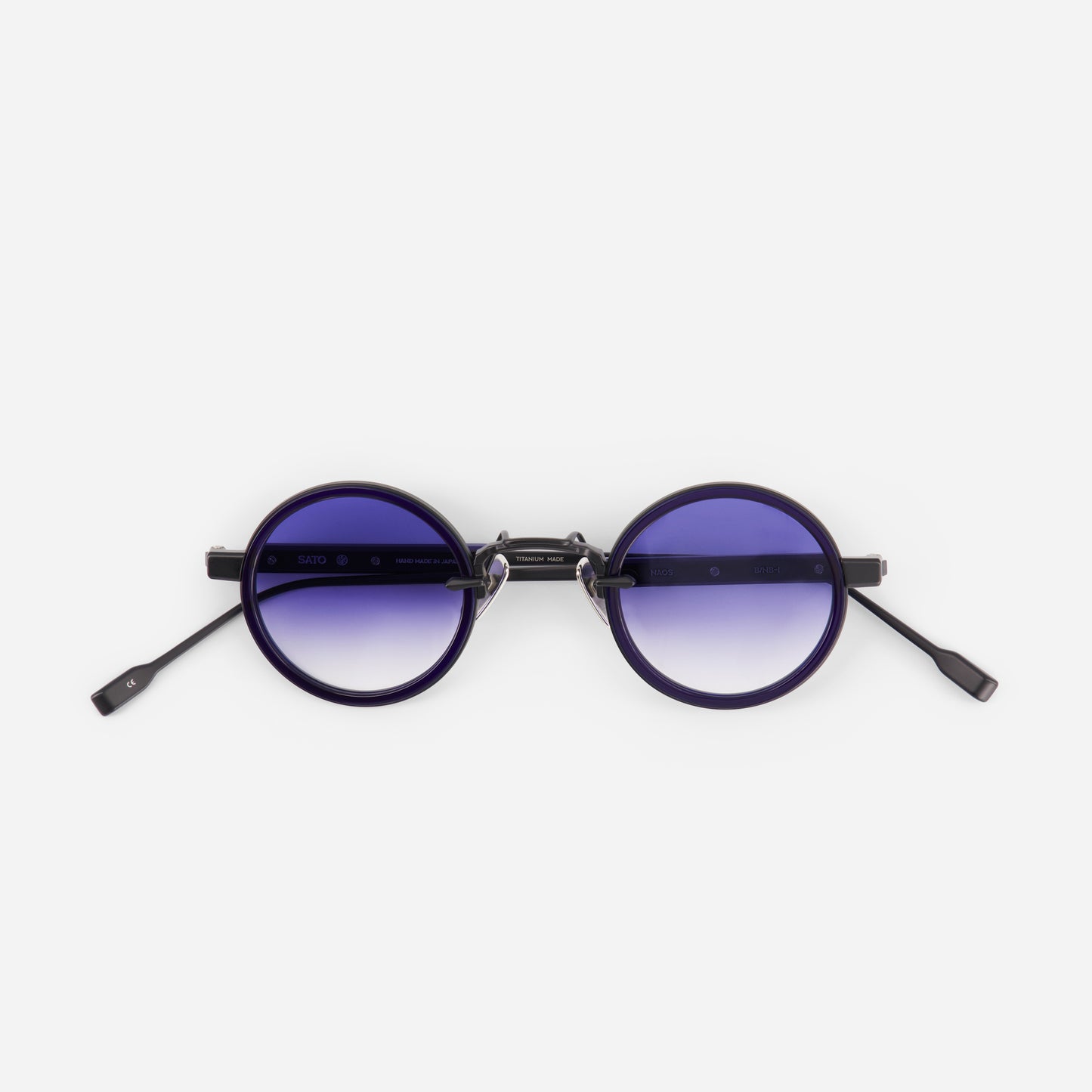 Round sunglasses with gradient purple lenses on a white background