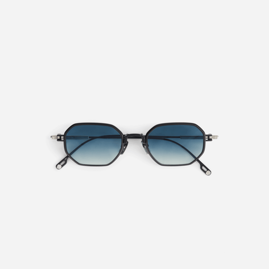 Timir S505 hexagonal glasses, meticulously crafted from sleek black titanium. These glasses boast captivating blue gradient tinted lenses, offering a bold and contemporary style for both men and women.