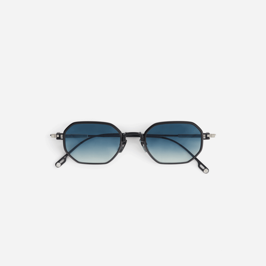 Timir S505 hexagonal glasses, meticulously crafted from sleek black titanium. These glasses boast captivating blue gradient tinted lenses, offering a bold and contemporary style for both men and women.