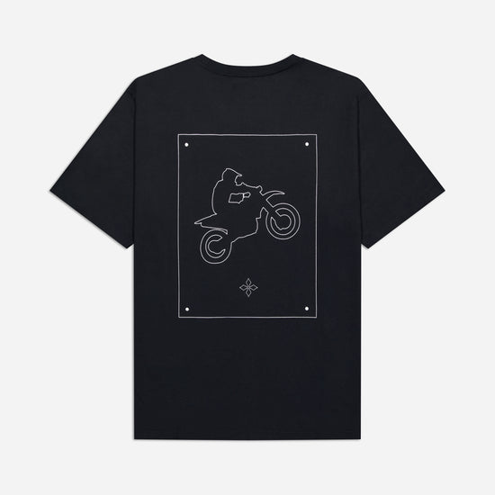 Black t-shirt with a white graphic of a person on a motorcycle on a light gray background