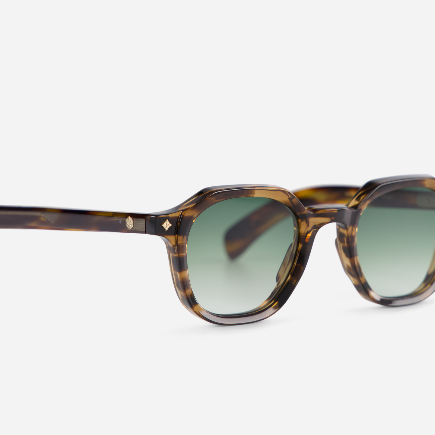 Explore the stylish combination of a Japanese acetate frame in Coyote tortoise color with gradient green lenses in the Perse CT-1.